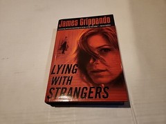 Lying with Strangers – Hardcover By James Grippando