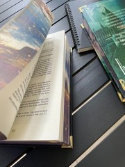 The limited edition hardcover novel Manacled (printed on three sides) collec